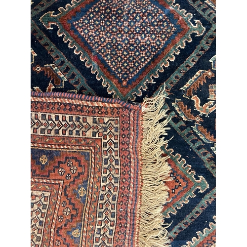 362 - A 19th century Persian Turkish floor carpet rug. The rug featuring central geometric pattern with bi... 