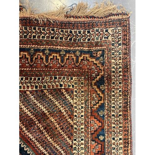 362 - A 19th century Persian Turkish floor carpet rug. The rug featuring central geometric pattern with bi... 