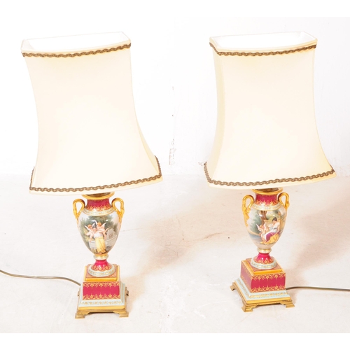 1010 - A pair of contemporary French style table light lamps. Having ceramic bases with Neoclassical scene,... 