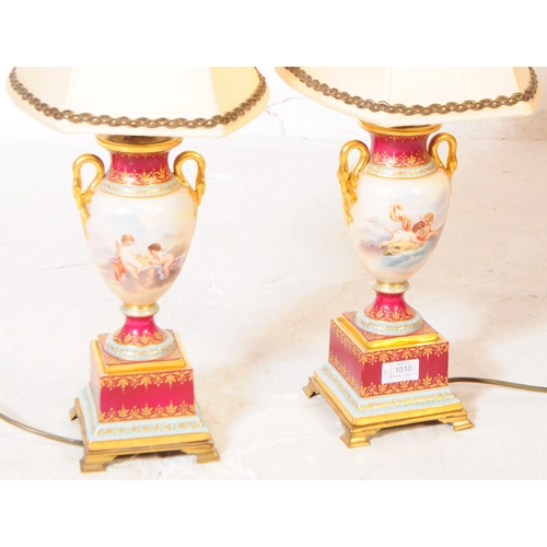 1010 - A pair of contemporary French style table light lamps. Having ceramic bases with Neoclassical scene,... 