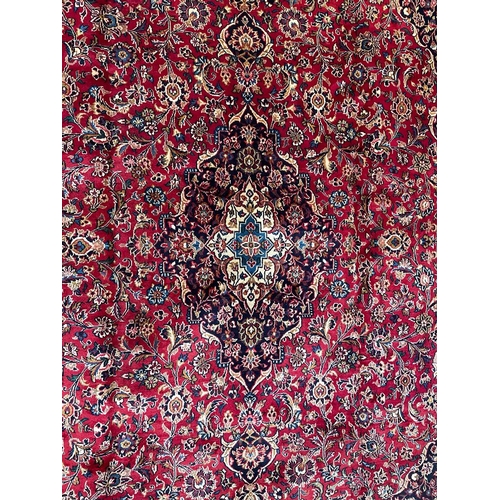 408 - A 20th century Central Persian Islamic Kashan floor carpet rug. The rug having a central medallion i... 