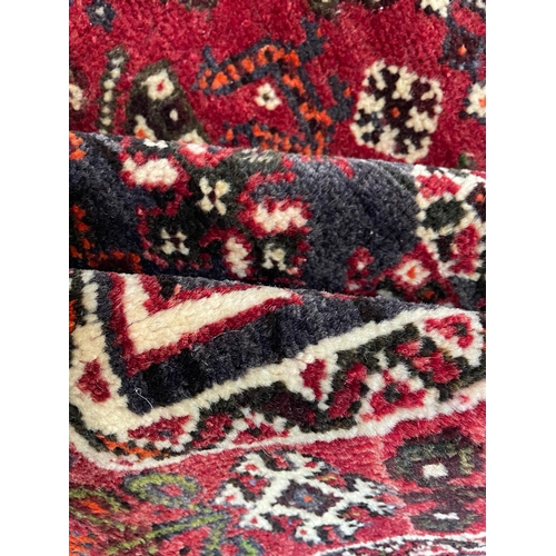 412 - A early 20th century South West Persian Islamic Qashgai floor carpet rug. The rug having a central g... 