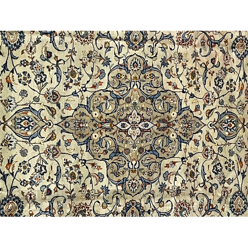 421 - An early 20th century Central Persian Islamic Kashan floor carpet rug. The rug having a mint green g... 