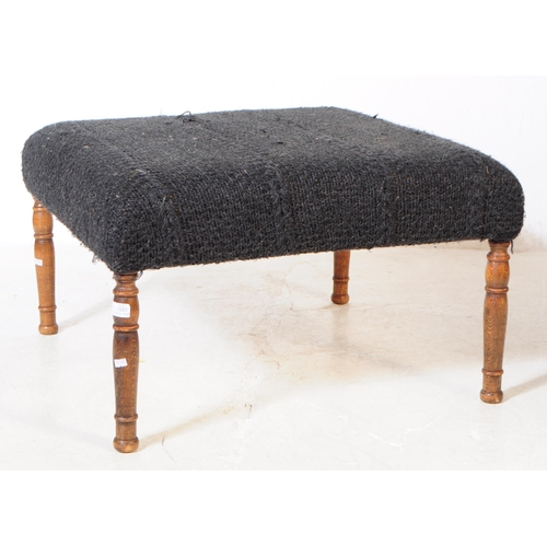 1051 - An early 20th Century square form black upholstery ottoman footstool upon turned oak legs. Measuring... 