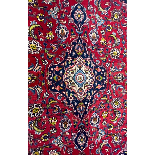 479 - A 20th century Central Persian Islamic Kashan floor carpet rug. The rug having central medallions in... 