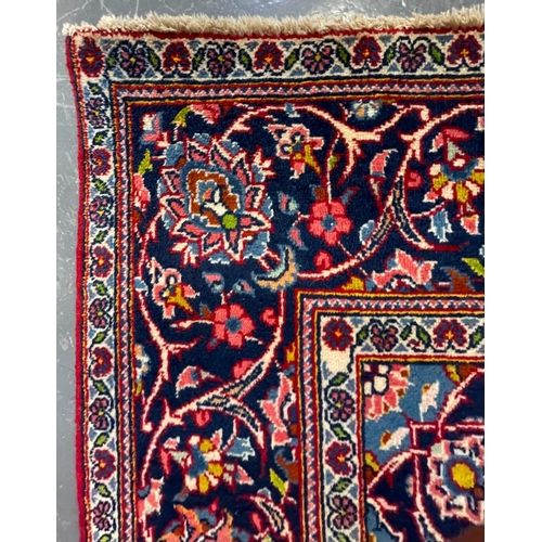 479 - A 20th century Central Persian Islamic Kashan floor carpet rug. The rug having central medallions in... 