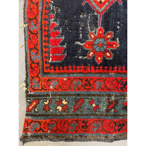 468 - An early 20th century Turkish Islamic floor carpet runner rug. The runner featuring floral fern styl... 