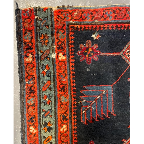 468 - An early 20th century Turkish Islamic floor carpet runner rug. The runner featuring floral fern styl... 