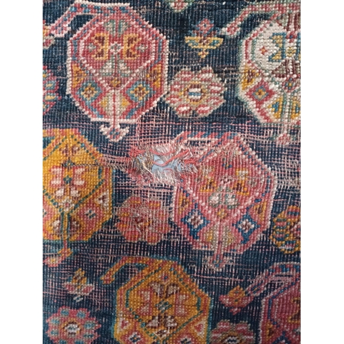 473 - A 19th century hand woven Persian Islamic Bidjar floor carpet rug. The rug having a central shaped m... 