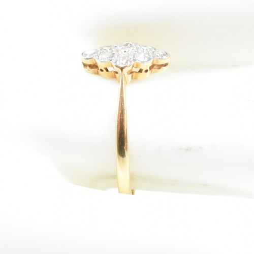 1 - An 18ct gold platinum and diamond cluster ring. The ring set with a cluster of nine round brilliant ... 