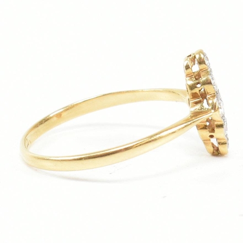 1 - An 18ct gold platinum and diamond cluster ring. The ring set with a cluster of nine round brilliant ... 