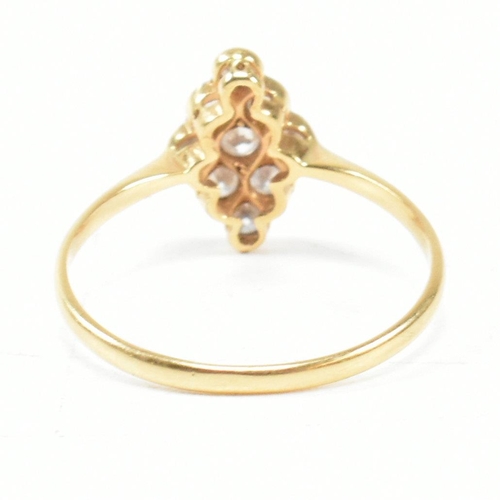 1 - An 18ct gold platinum and diamond cluster ring. The ring set with a cluster of nine round brilliant ... 