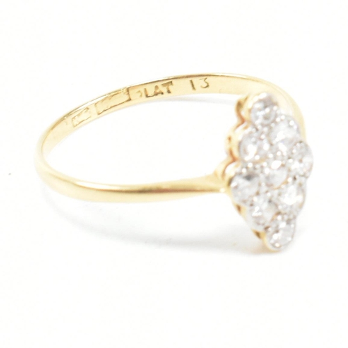 1 - An 18ct gold platinum and diamond cluster ring. The ring set with a cluster of nine round brilliant ... 