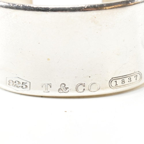 100 - A Tiffany & Co 1837 sterling silver wide cuff bangle. The Tiffany open cuff bangle stamped with 'T &... 