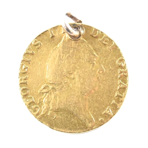 104 - A 1787 gold George III Guinea coin. The 22ct gold Spade Guinea coin, dated 1787, having the fifth la... 