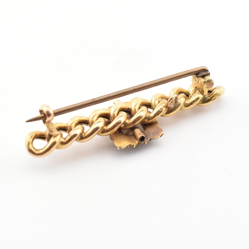 106 - A 19th century 15ct gold Suffragette chain and buckle brooch pin. The brooch having a half pearl set... 