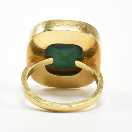 107 - A 1970s 18ct gold and malachite panel ring. The ring set with a malachite plaque. Stamped 18ct and S... 