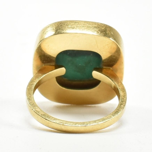 107 - A 1970s 18ct gold and malachite panel ring. The ring set with a malachite plaque. Stamped 18ct and S... 