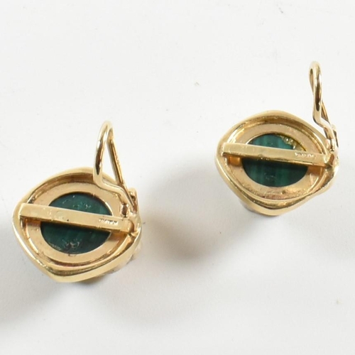 109 - A pair of 18ct gold and malachite ear clips. The earrings having round bezel mounted malachite caboc... 