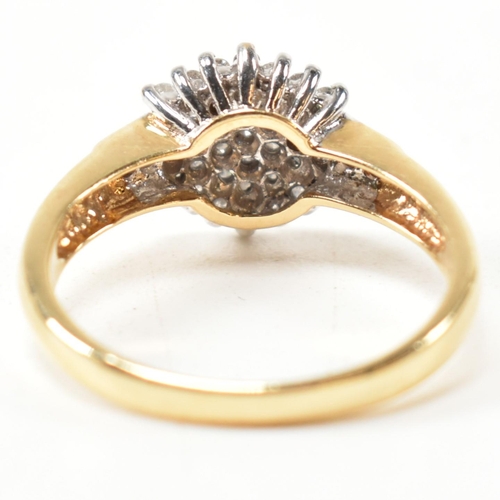 113 - A hallmarked 18ct gold and diamond cluster ring. The ring having a hexagonal shape cluster of round ... 