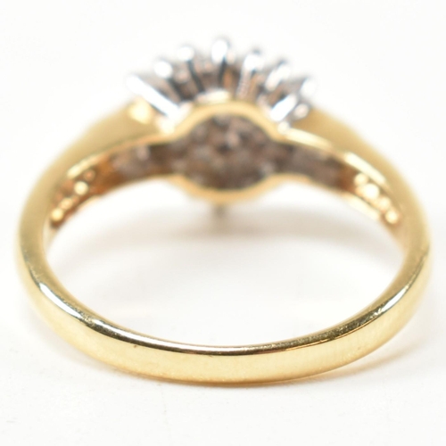 113 - A hallmarked 18ct gold and diamond cluster ring. The ring having a hexagonal shape cluster of round ... 