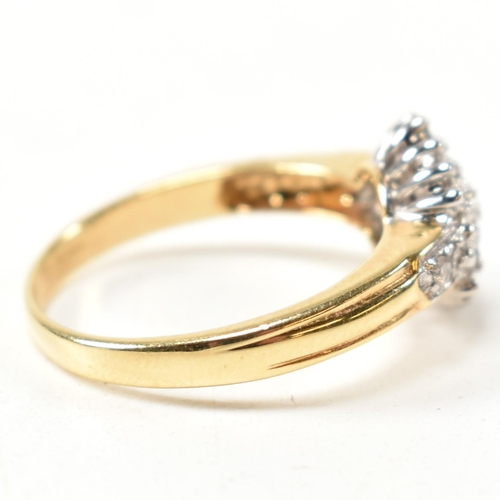 113 - A hallmarked 18ct gold and diamond cluster ring. The ring having a hexagonal shape cluster of round ... 