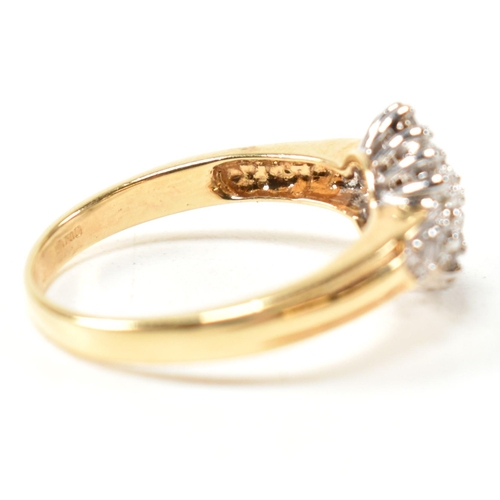 113 - A hallmarked 18ct gold and diamond cluster ring. The ring having a hexagonal shape cluster of round ... 