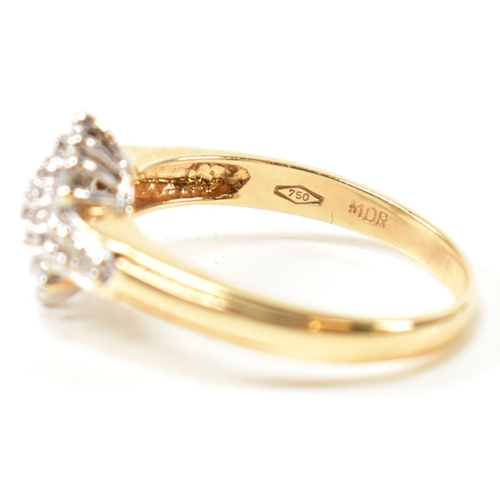 113 - A hallmarked 18ct gold and diamond cluster ring. The ring having a hexagonal shape cluster of round ... 