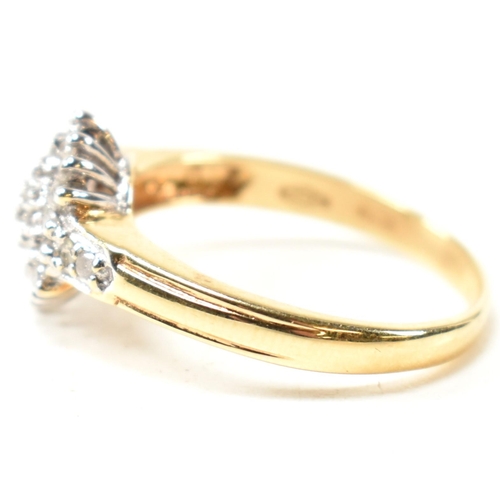 113 - A hallmarked 18ct gold and diamond cluster ring. The ring having a hexagonal shape cluster of round ... 