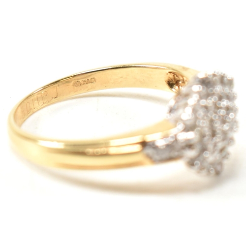 113 - A hallmarked 18ct gold and diamond cluster ring. The ring having a hexagonal shape cluster of round ... 