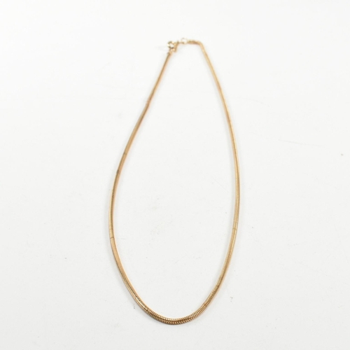 115 - A hallmarked 9ct gold snake chain necklace. The necklace hallmarked with an import mark for Birmingh... 