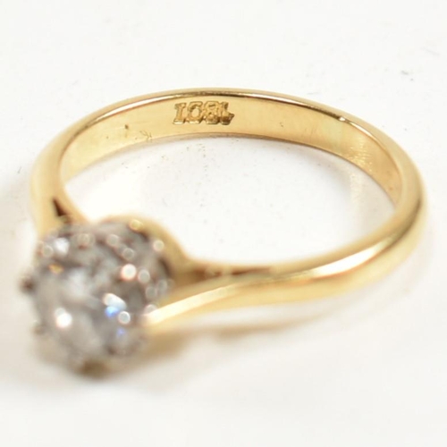 120 - A hallmarked 18ct gold and diamond solitaire ring. The 18ct gold ring set with a single eight claw s... 