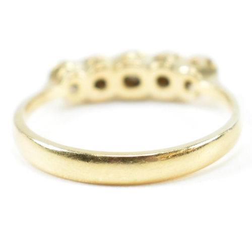 121 - An 18ct gold illusion set diamond five stone ring. The 18ct gold ring having a single row of five il... 