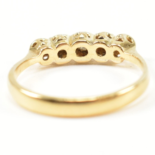 121 - An 18ct gold illusion set diamond five stone ring. The 18ct gold ring having a single row of five il... 