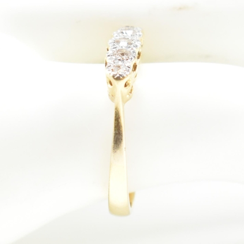 121 - An 18ct gold illusion set diamond five stone ring. The 18ct gold ring having a single row of five il... 