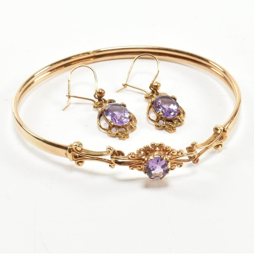 122 - Victorian style hallmarked 9ct gold and amethyst bangle and earring set. The jewellery set to includ... 