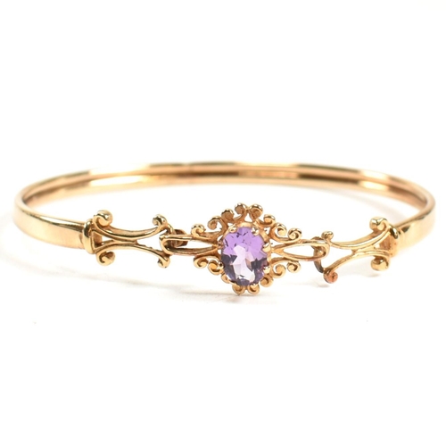 122 - Victorian style hallmarked 9ct gold and amethyst bangle and earring set. The jewellery set to includ... 