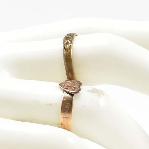 124 - A Victorian hallmarked 9ct gold heart signet ring together with a gold tone metal ring. The heart ri... 