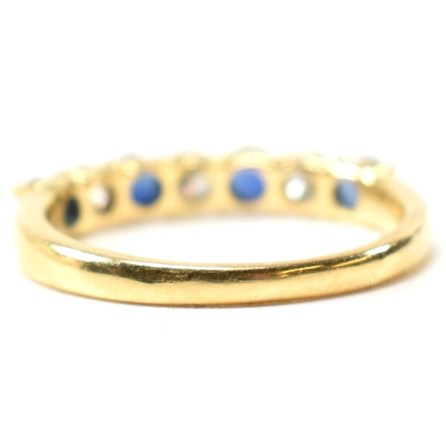 127 - A hallmarked 18ct gold, sapphire and diamond half hoop ring. The ring having four shared claw set ro... 