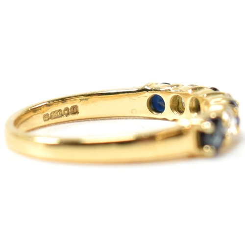 127 - A hallmarked 18ct gold, sapphire and diamond half hoop ring. The ring having four shared claw set ro... 