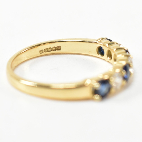 127 - A hallmarked 18ct gold, sapphire and diamond half hoop ring. The ring having four shared claw set ro... 