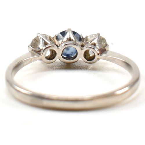 129 - A platinum, sapphire and diamond three stone ring. The platinum trilogy ring having a central round ... 