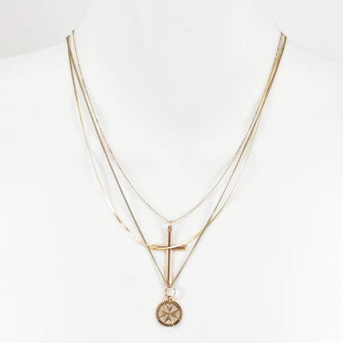 132 - Three 9ct gold necklaces. A hallmarked 9ct gold Maltese cross pendant strung on a curb link chain ne... 