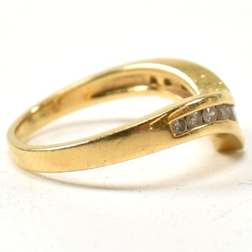 133 - A hallmarked 18ct gold and diamond wishbone ring. The 18ct gold wishbone ring having eleven channel ... 