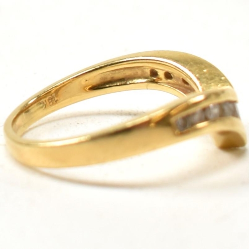 133 - A hallmarked 18ct gold and diamond wishbone ring. The 18ct gold wishbone ring having eleven channel ... 