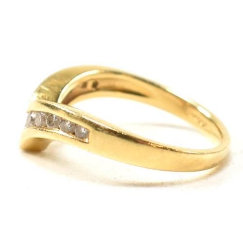 133 - A hallmarked 18ct gold and diamond wishbone ring. The 18ct gold wishbone ring having eleven channel ... 