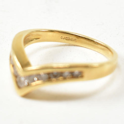 133 - A hallmarked 18ct gold and diamond wishbone ring. The 18ct gold wishbone ring having eleven channel ... 