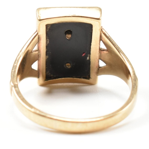 134 - A 9ct gold and onyx Art Deco initial signet ring. The 9ct gold gentleman's signet ring having a rect... 