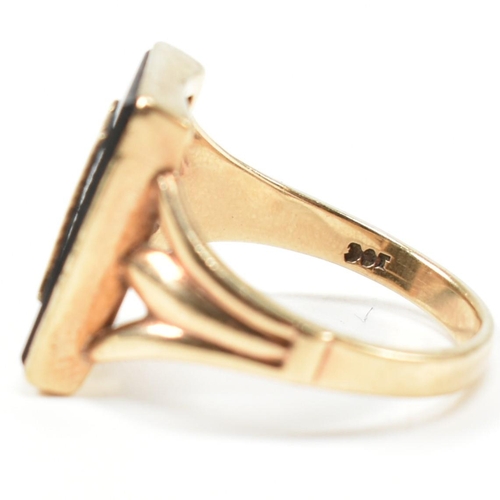 134 - A 9ct gold and onyx Art Deco initial signet ring. The 9ct gold gentleman's signet ring having a rect... 