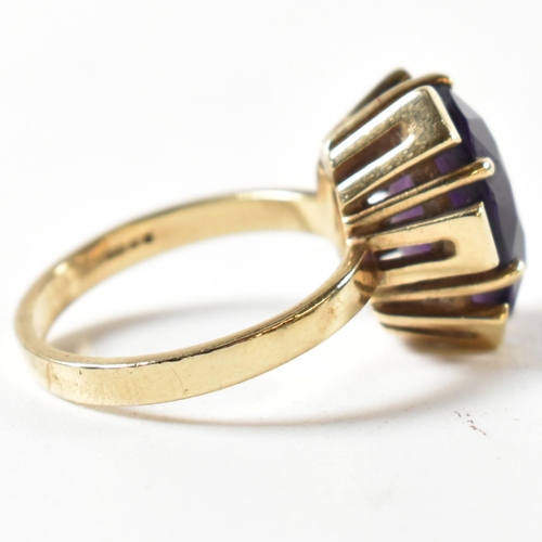 138 - A hallmarked 9ct gold and amethyst ring. The ring bearing import hallmark for London 1979. Weight 5g... 